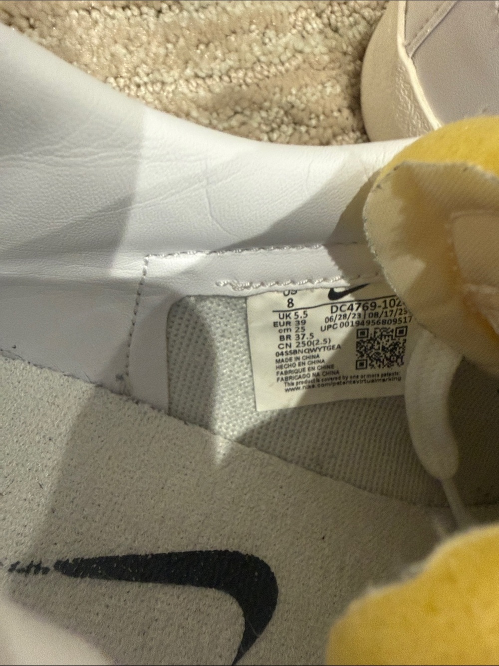 Nike White Low-Top Sneakers with Black Swoosh - Picture 2 of 3